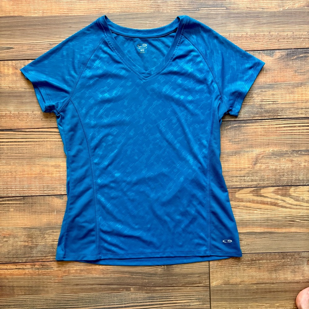 Vibrant dark teal blue athletic top